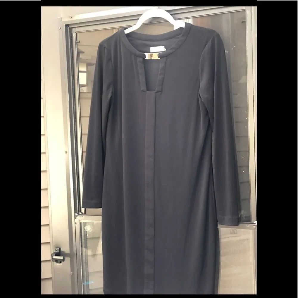 28-Beautiful black Calvin Klein dress with gold buckle on the neck. Size 8